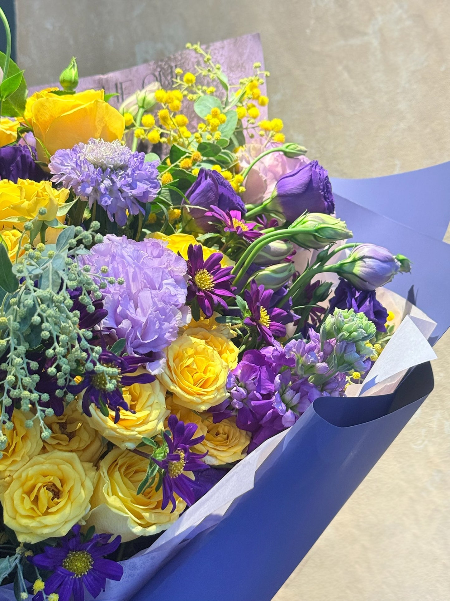 Side angle of The Perfect Moment anniversary bouquet 黃紫花束 arrangement