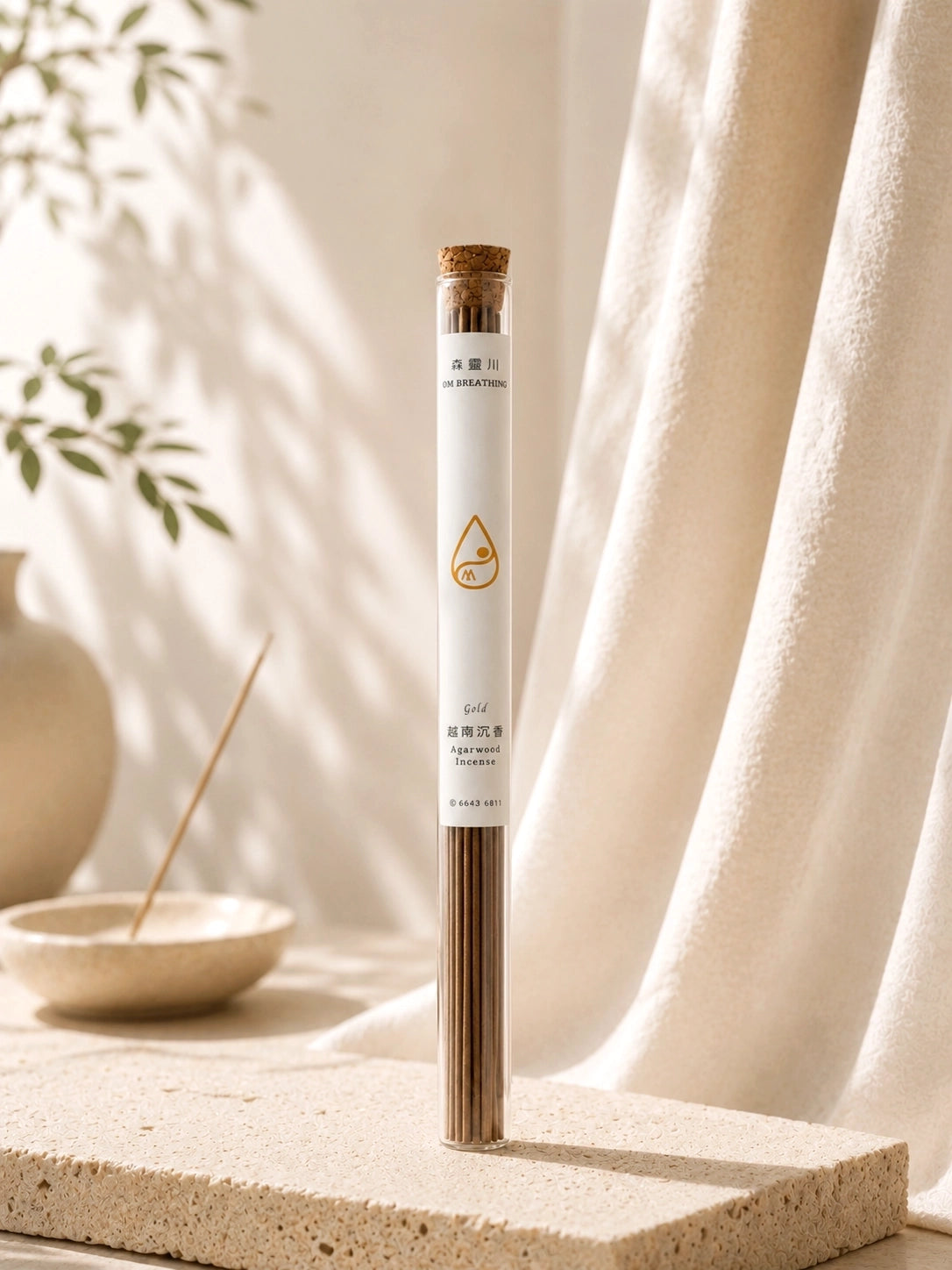 Agarwood incense with 30 sticks, approximately 40-minute burn time, displayed in a clear glass tube on a neutral styled background.