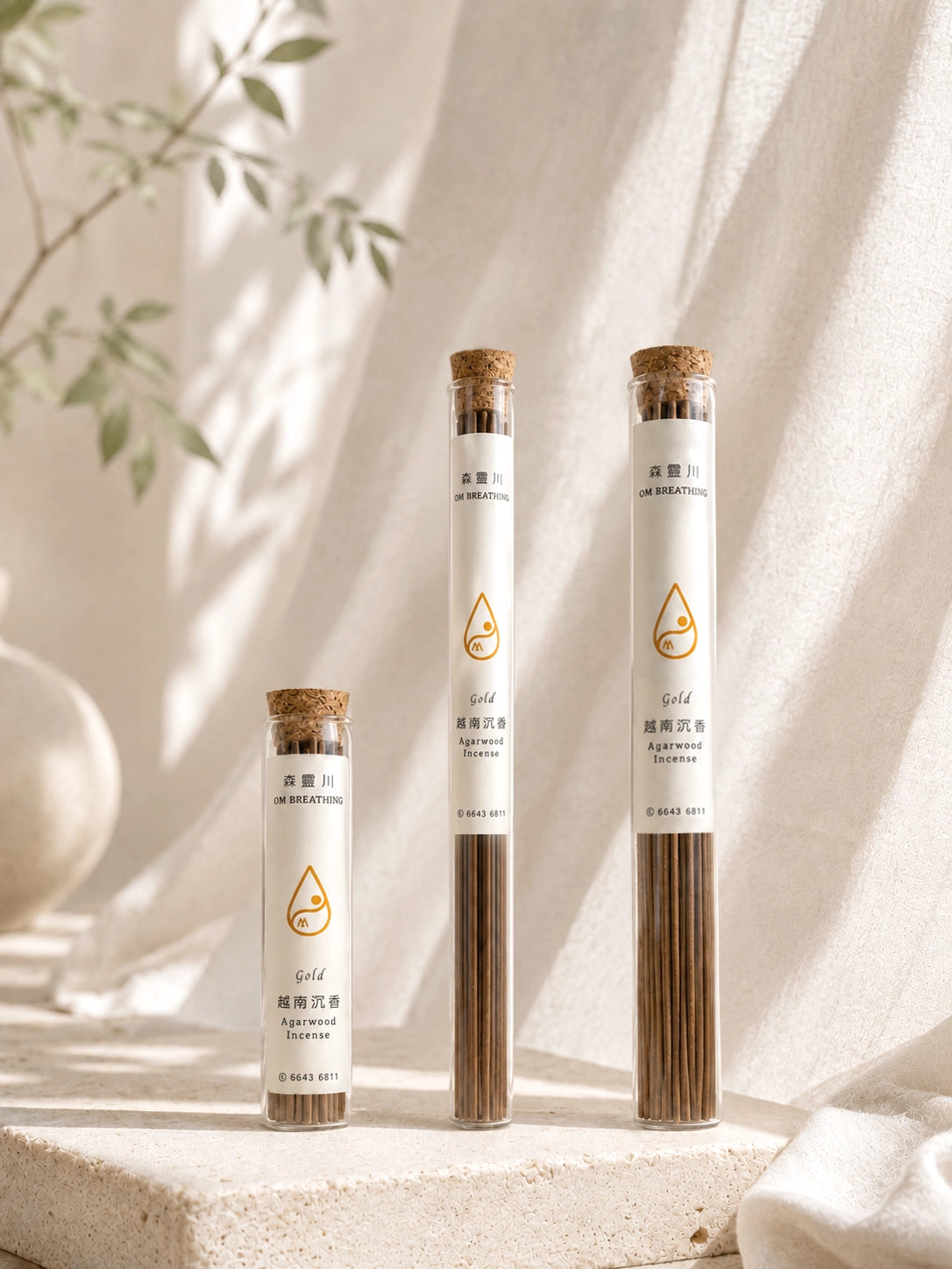 Collection of agarwood incense tubes featuring 30-stick and 108-stick options with different burn times, displayed on a serene neutral background.